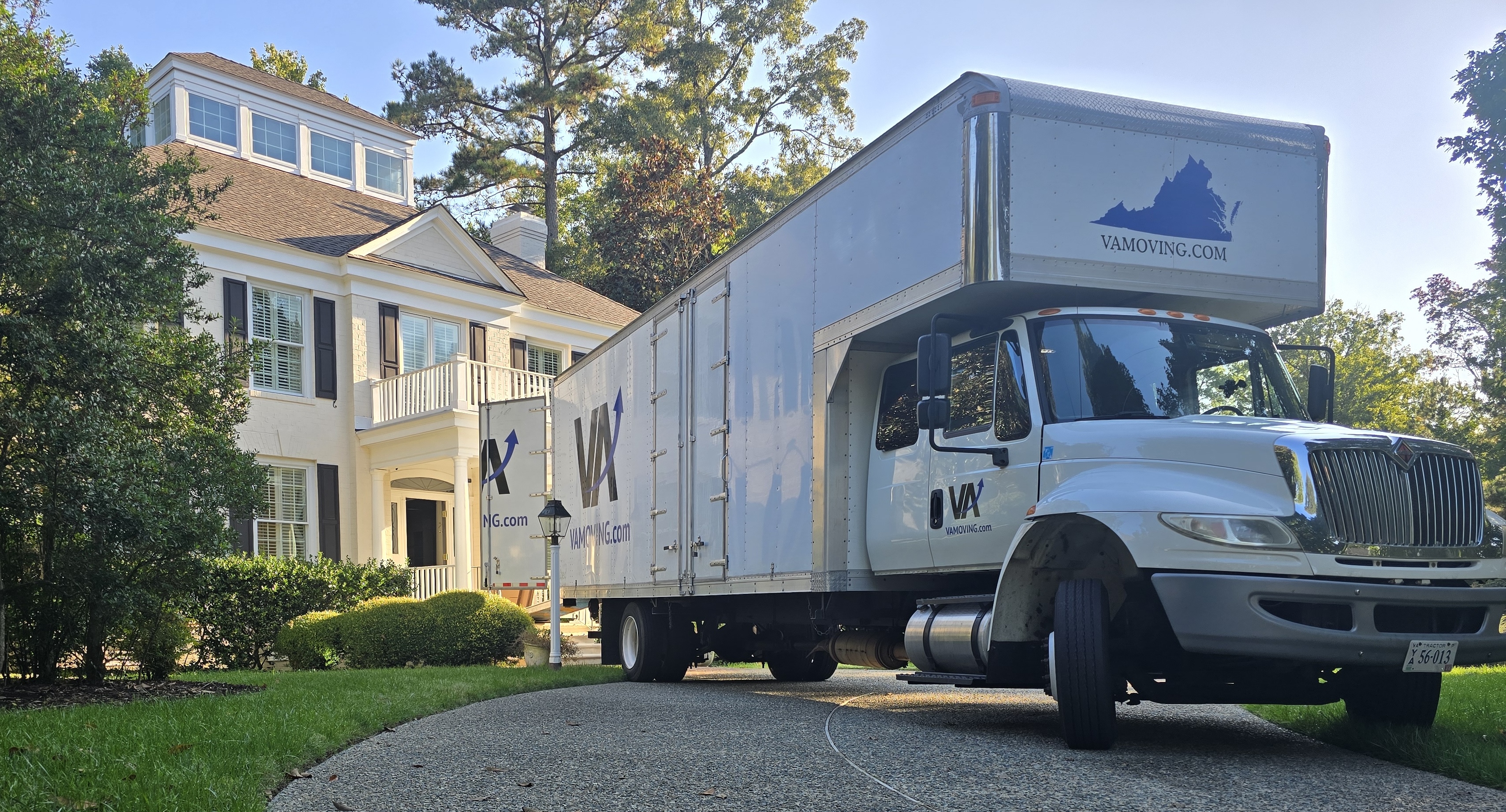 Large moving truck in front of a house